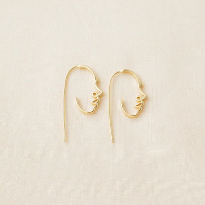 Gold-plated sterling silver face earrings