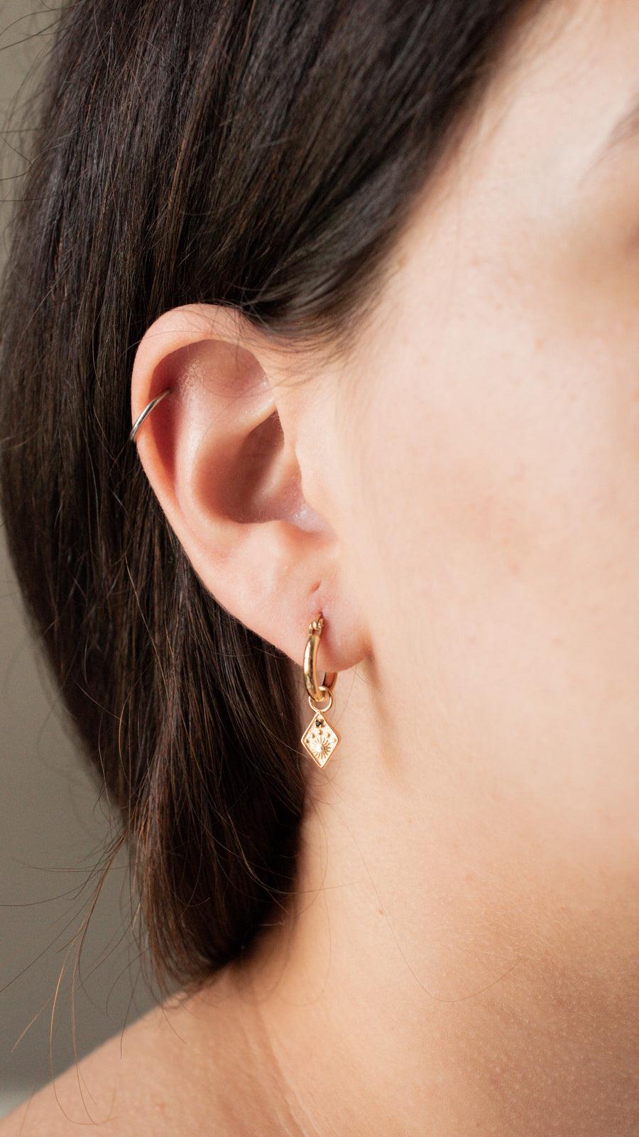 sun earrings display gold-plate hoop earrings with dainty sun charms