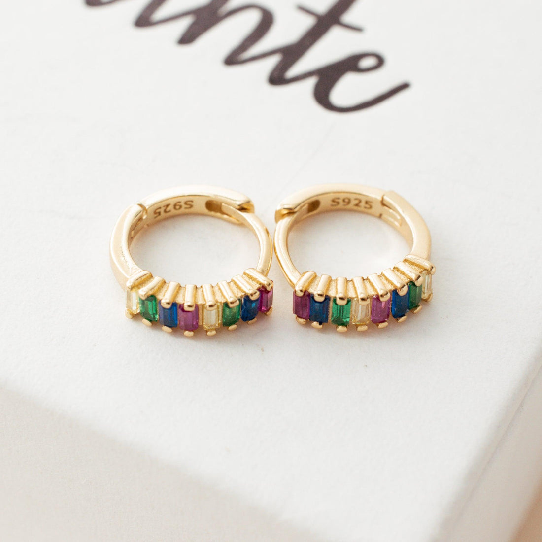 Multicolor Crystal Hoop Earrings photo shows a huggie earring with multicolor crystal and the S925 mark on a white background