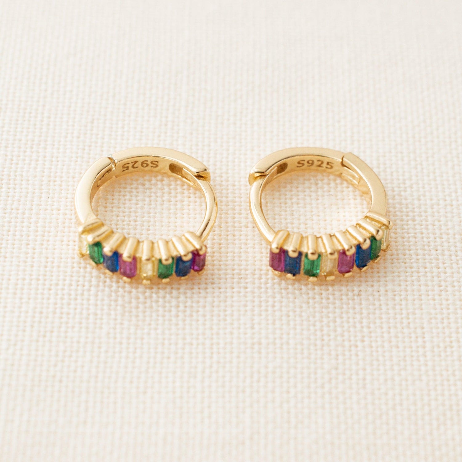 Detail of the Multicolor Crystal Hoop Earrings show crystals in pink, blue, green and yellow colors