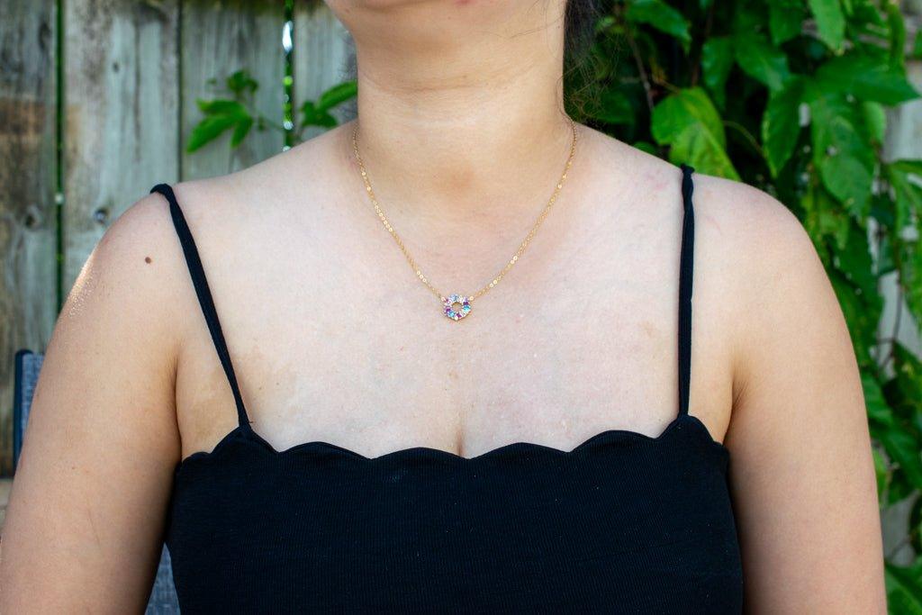 Rainbow Crystal Necklace on model wearing a black top| avantejewel.com